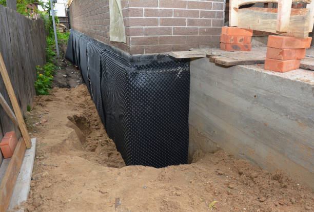 Happy homeowners after waterproofing job in Empire